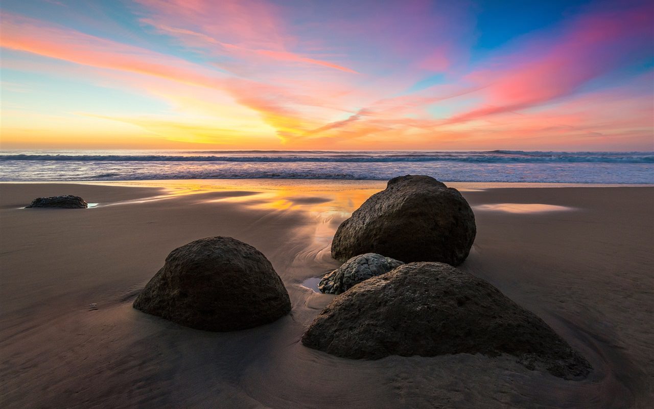 Sea stones sunset beach