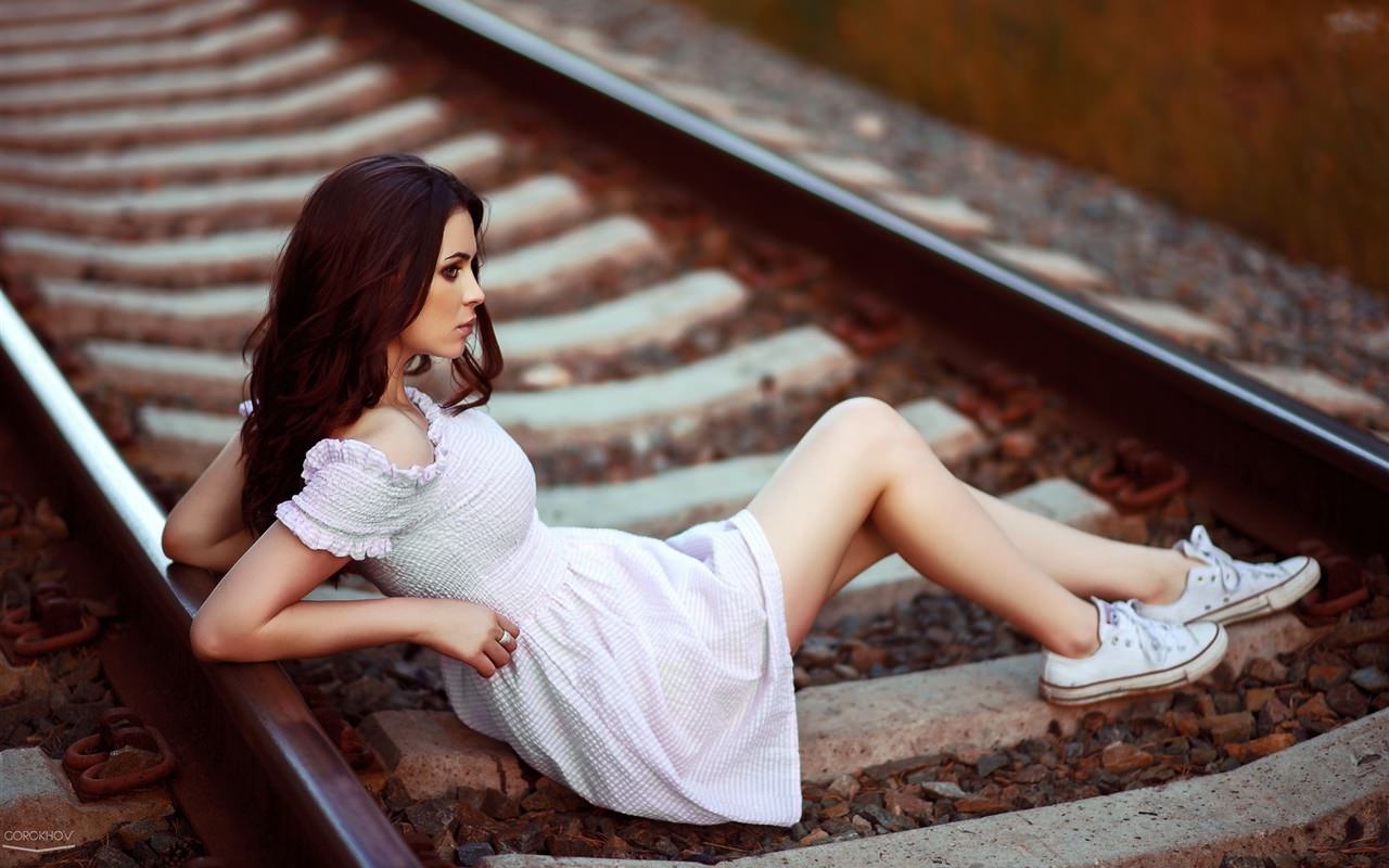 Girl Lying at Railroad