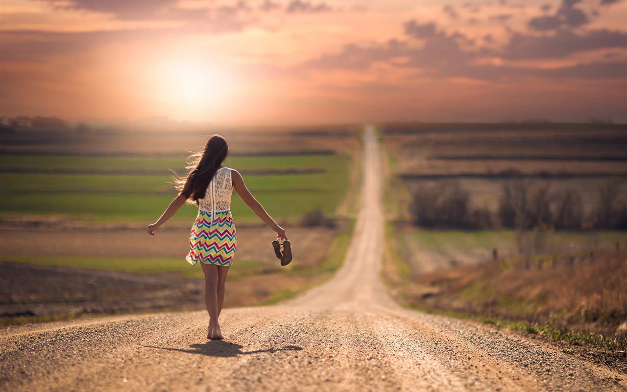 Girl walking in the road