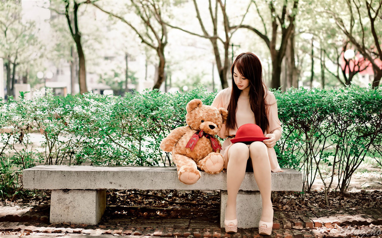Asian Girl and Teddy Bear on Bench