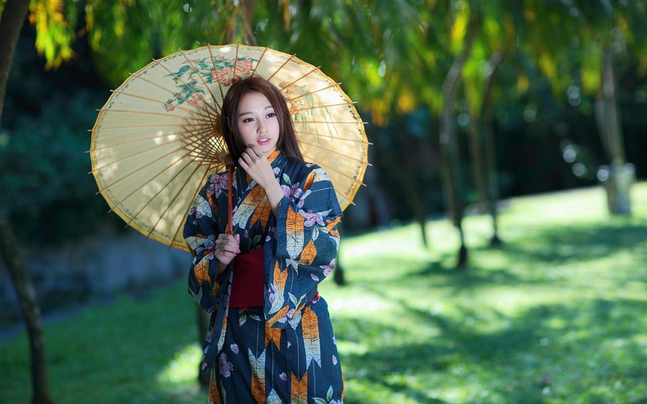 Asian Girl Using an Umbrella
