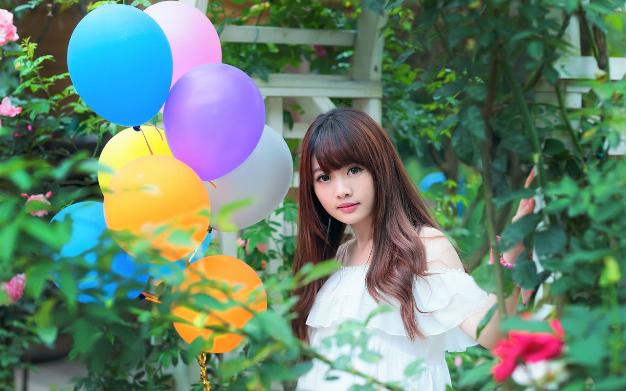 Lovely Asian Girl with Colorful Balloons