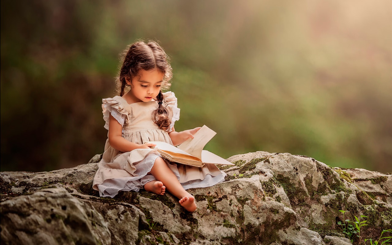 Lovely Little Girl Reading Book