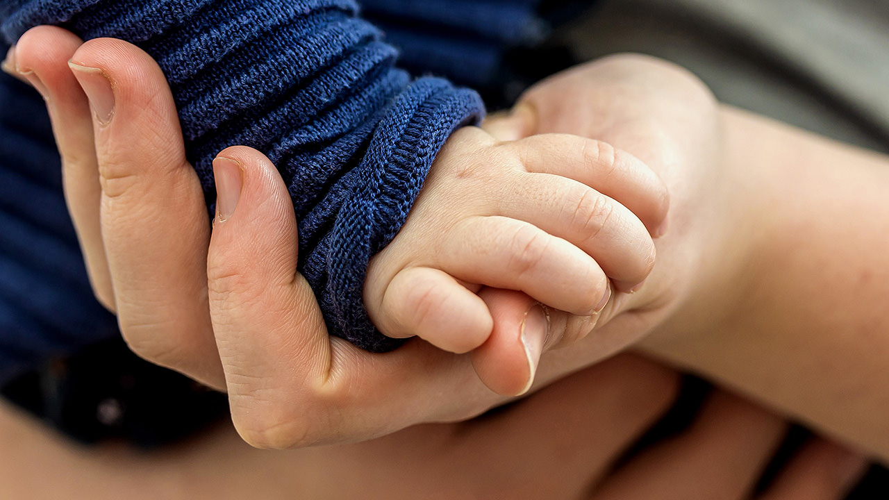 Hands of Mom And Baby