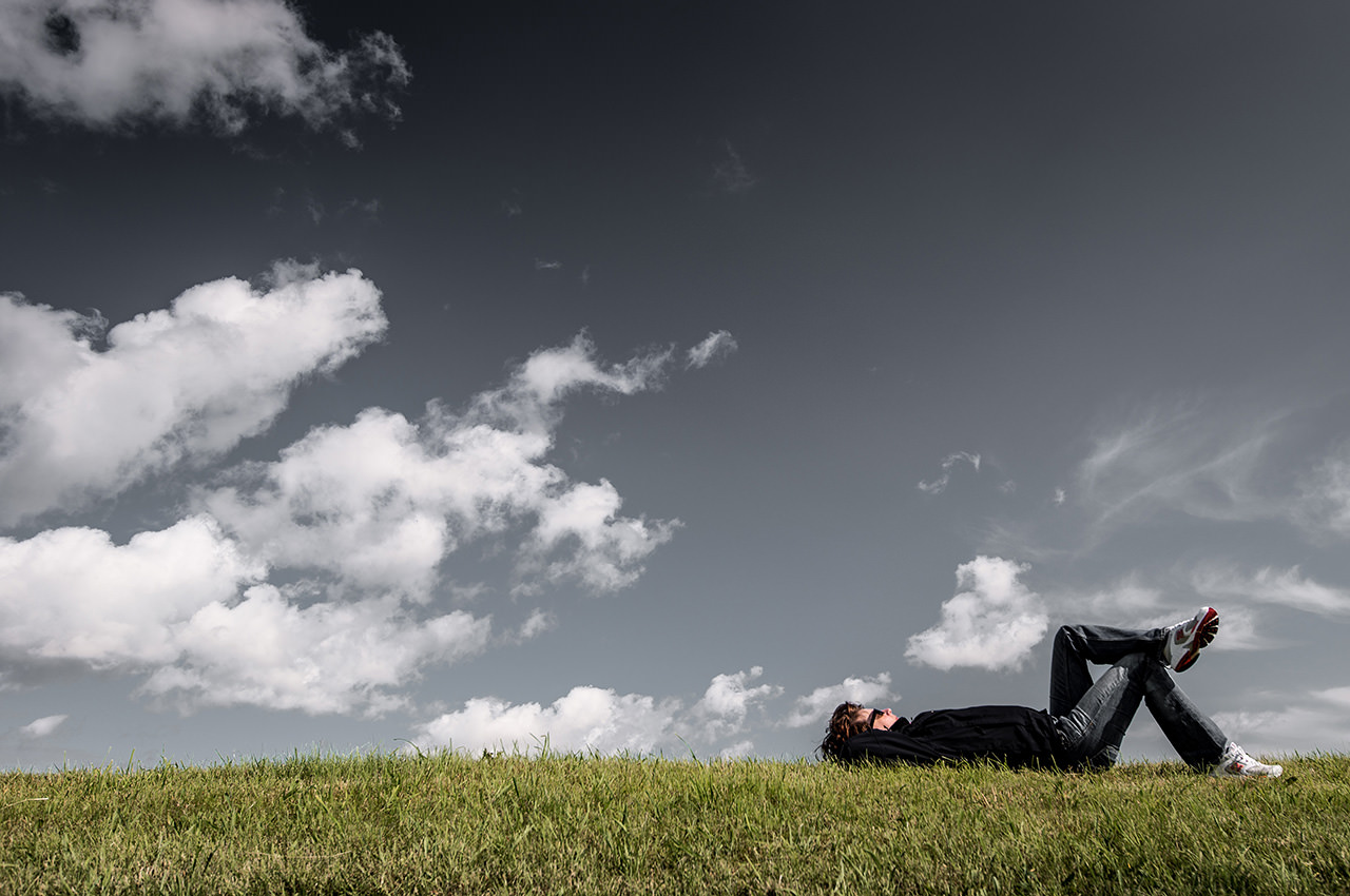 Man is lying on the grass