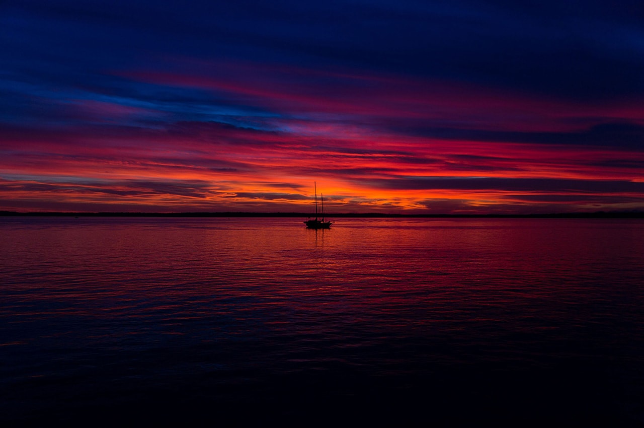 Dark Sunset Ocean Sailboat